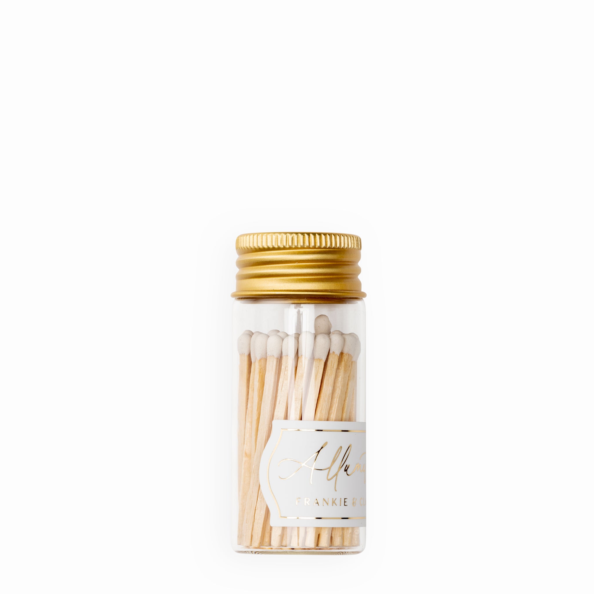 Sleek white match tips in Frankie & Claude's petite Allumette Match Jar, featuring a clear glass container and a luxurious gold screw-on lid.