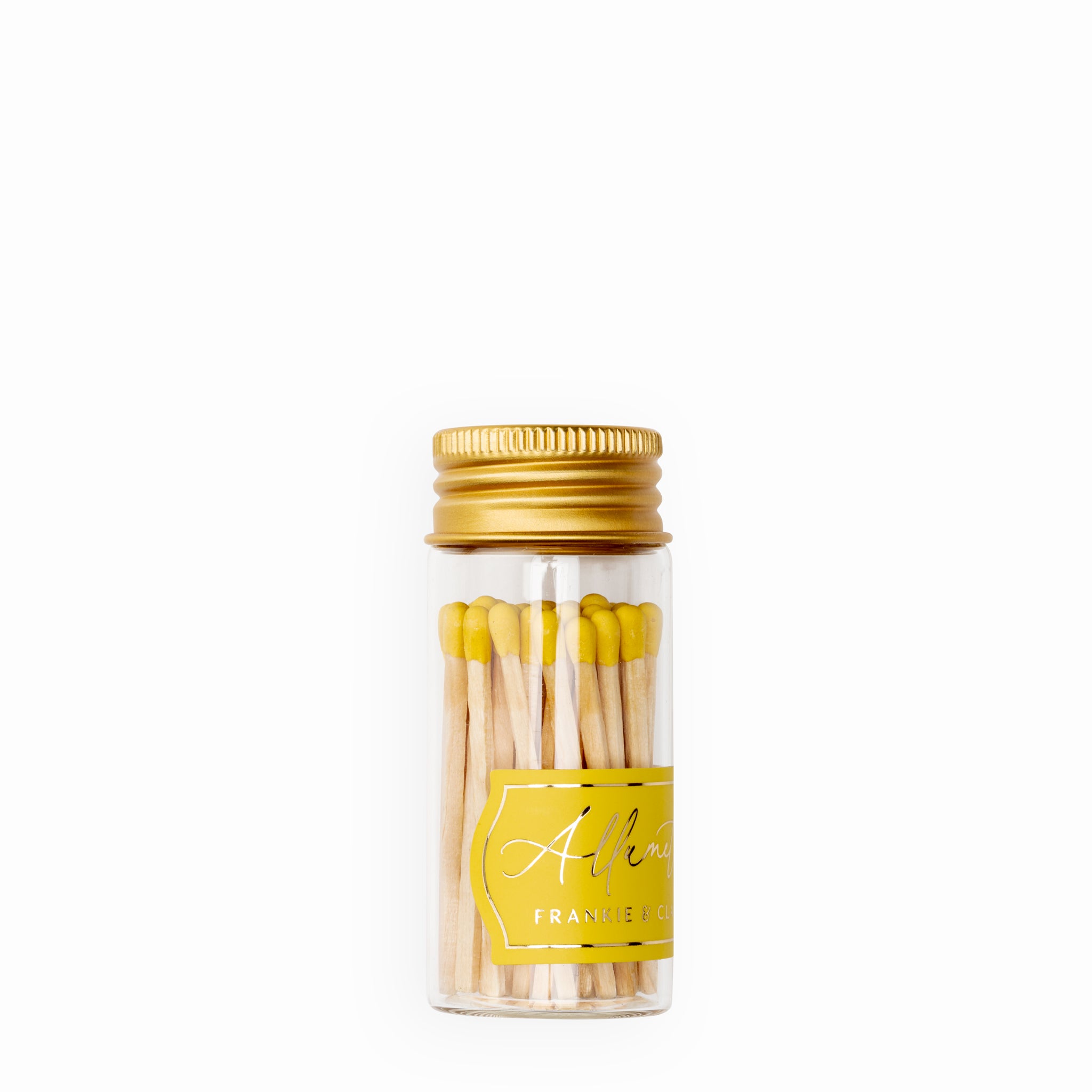 Frankie & Claude's Allumette Match Jar with vibrant yellow match tips in a clear glass jar topped with a gold screw cap, perfect for adding a pop of color to any setting.