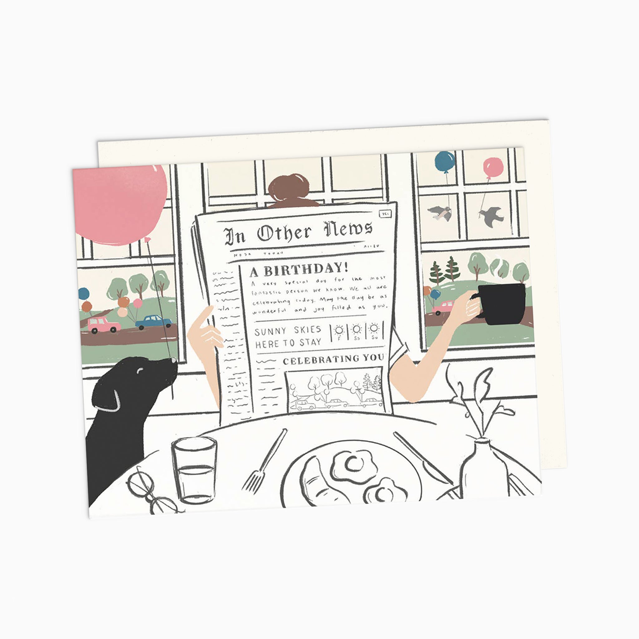Illustrated chic birthday card on warm white premium cardstock, featuring a woman reading a newspaper at a brunch table with a black lab holding a pink balloon, and a scenic backdrop of birds with balloons through a window.