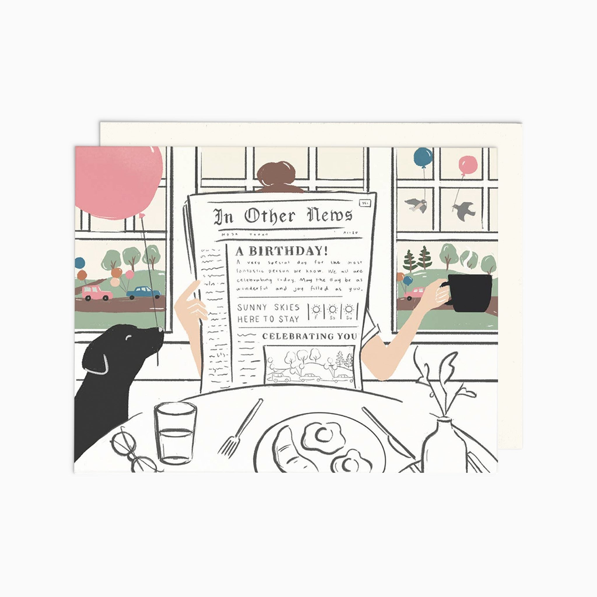 Illustrated chic birthday card on warm white premium cardstock, featuring a woman reading a newspaper at a brunch table with a black lab holding a pink balloon, and a scenic backdrop of birds with balloons through a window.