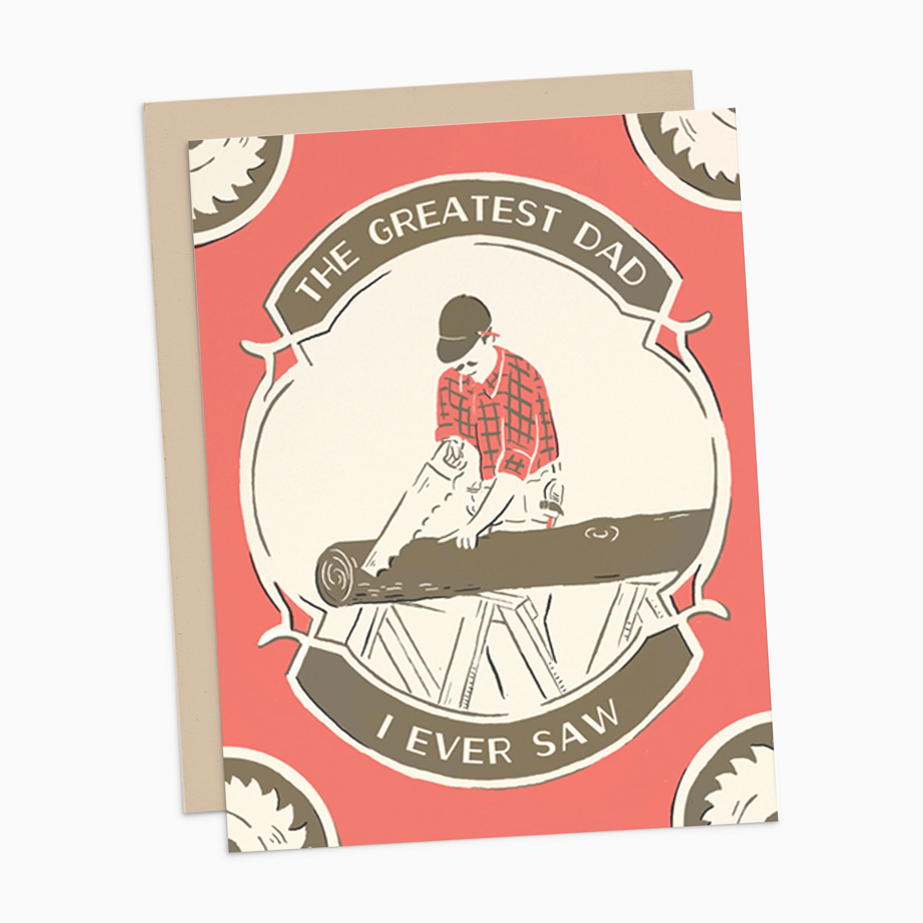 Illustrated Father's Day card on warm white cover cardstock, showing a person sawing a log and the punny text 'the greatest dad I ever saw,' perfect for celebrating Dad's special day. Positioned on a neutral background.