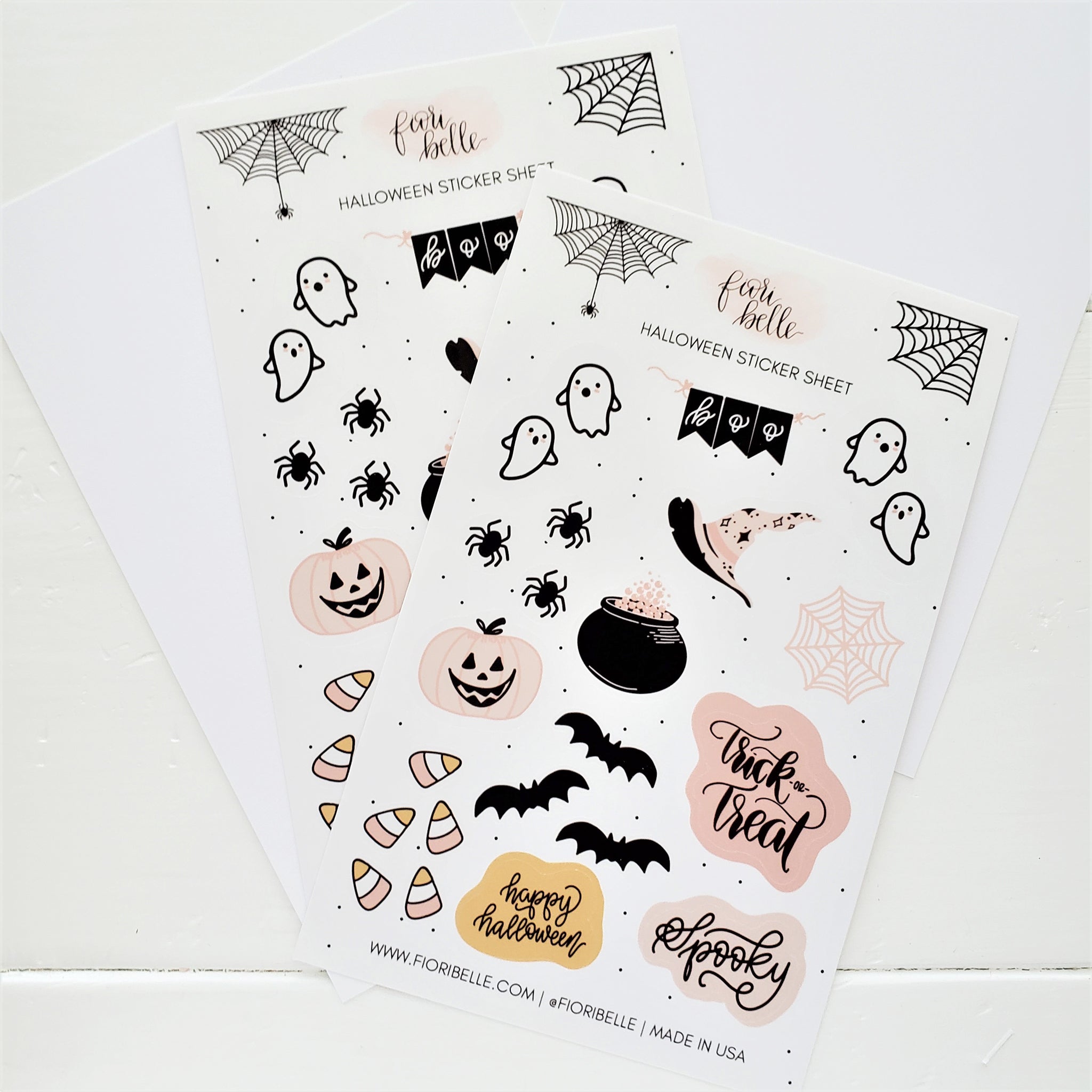 "Halloween Sticker Sheet featuring 23 glossy vinyl stickers including cute ghosts, spiders, and candy corn, hand-written halloween phrases, a witch cauldron & hat,  displayed on a pastel background. Great for personalizing planners, laptops, and water bottles.