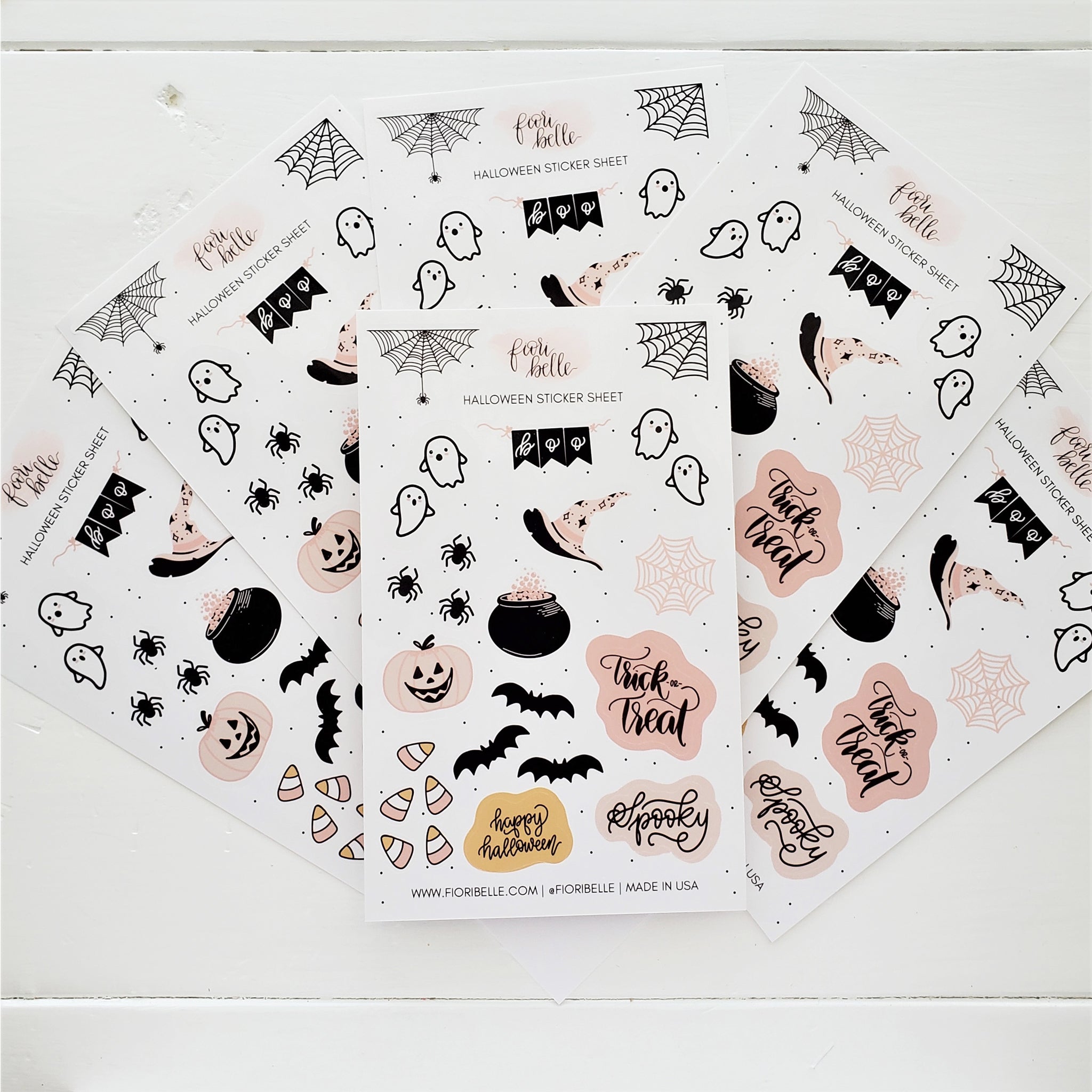 "Halloween Sticker Sheet featuring 23 glossy vinyl stickers including cute ghosts, spiders, and candy corn, hand-written halloween phrases, a witch cauldron & hat,  displayed on a pastel background. Great for personalizing planners, laptops, and water bottles.