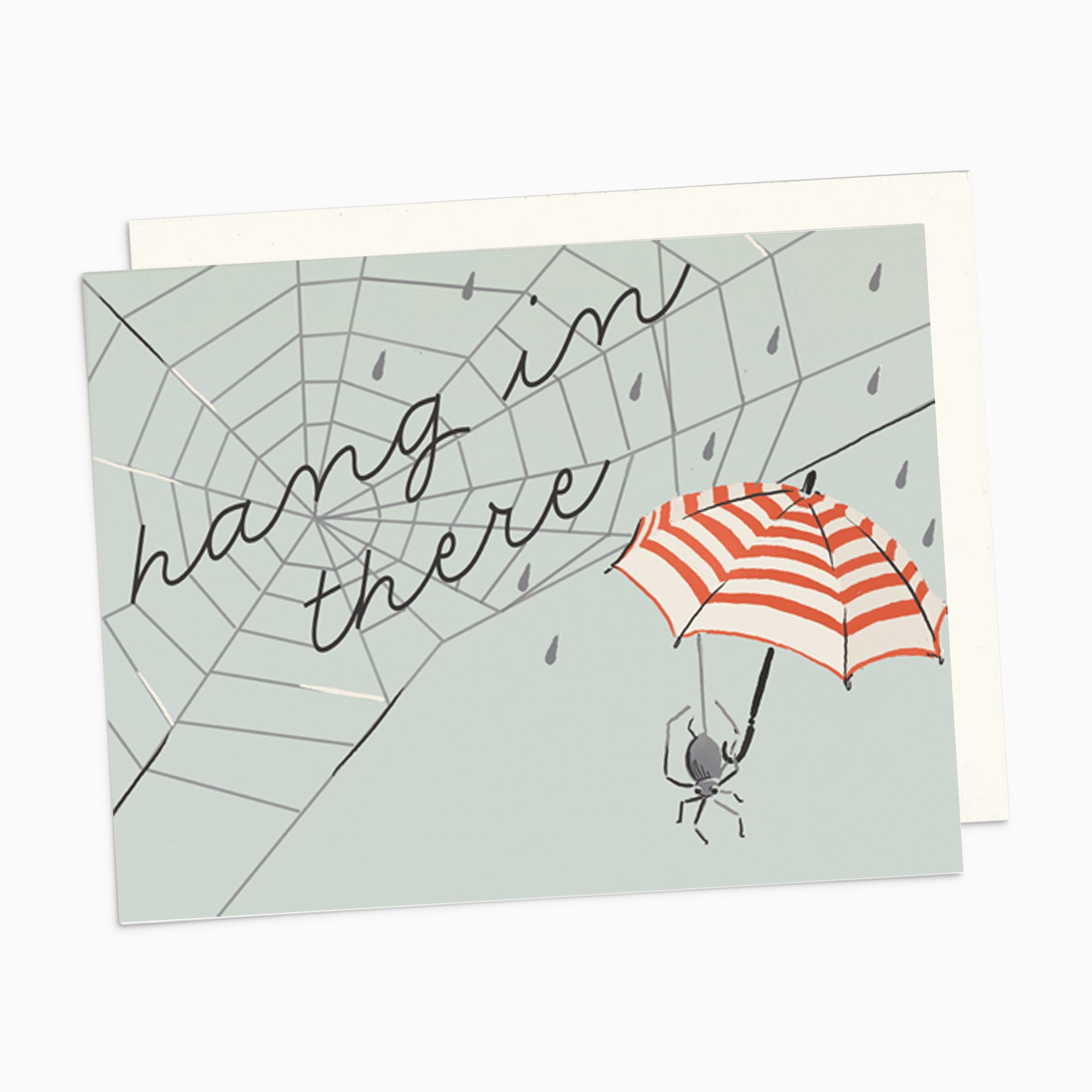 Illustrated sympathy card on premium warm white cardstock, featuring a spider web with the words 'Hang in There' and a spider holding a red and white striped umbrella on a pale blue background.