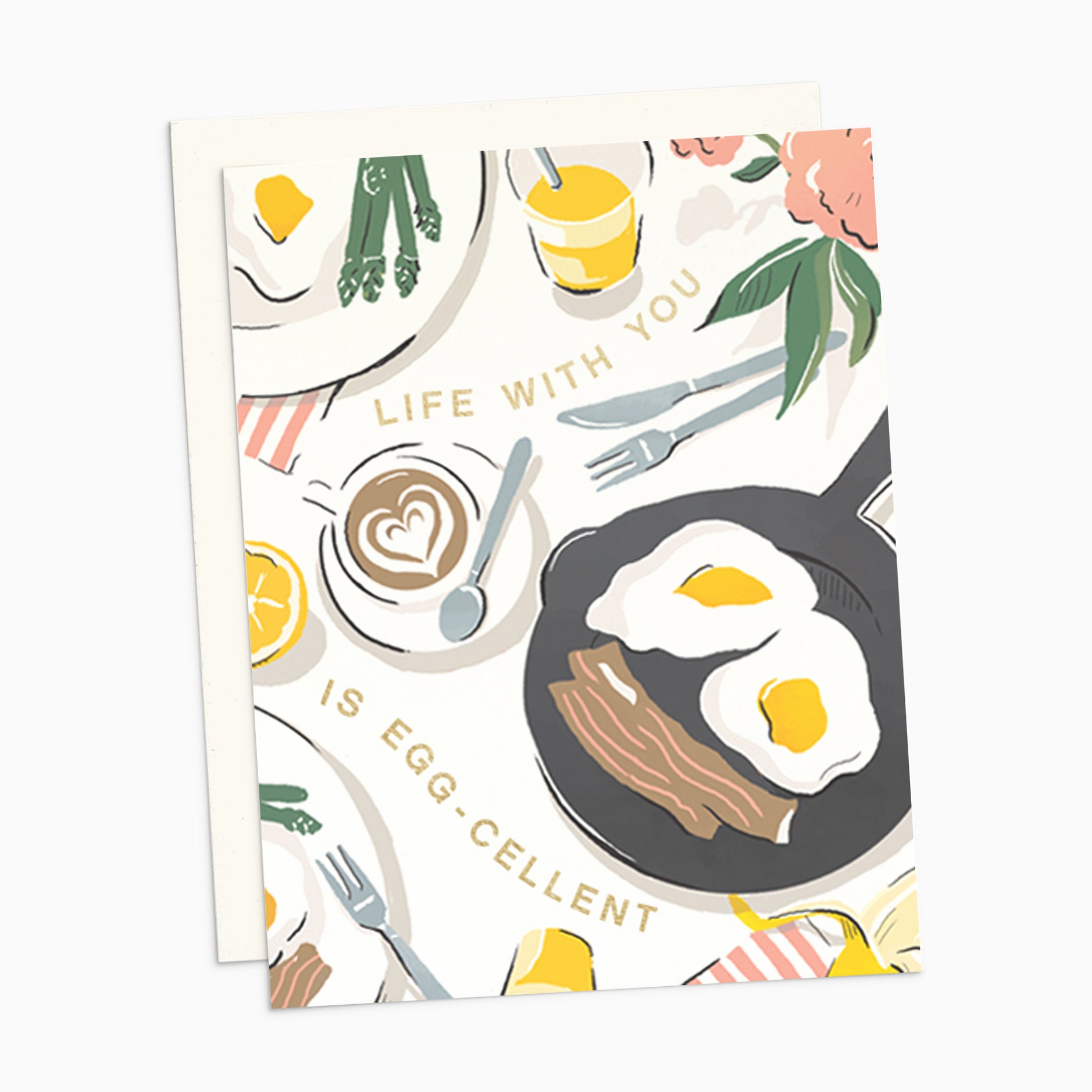 Illustrated 'Just Because' card on warm white premium cardstock, featuring a breakfast tablescape of eggs, bacon, and a latte with the text 'Life With You Is Egg-cellent.